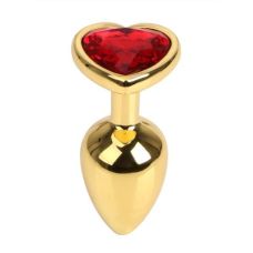 Анальна пробка золотого кольору з червоним кристалом у вигляді сердечка S